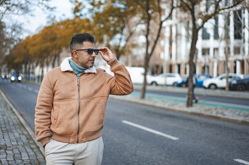 Mature man wearing sunglasses on the street