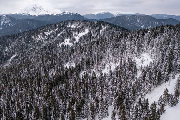 istock Aerial view of snowy mountain with by drone 2041199363