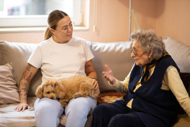 istock Young woman talking to a senior 2041208152