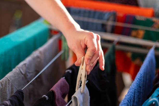istock the woman hangs the laundry 2041269312