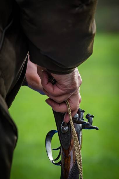 istock a man prepares his percussion rifle at a clay pigeon shoot for muzzleloaders 2041271919