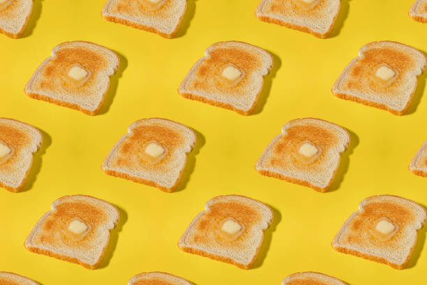 istock Creative food background, pattern with a slices of toasted bread and butter 2041290565