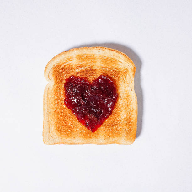 istock Bread slice, toast with jam in a shape of heart 2041290567
