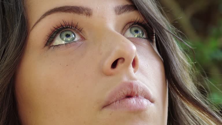 daydreaming young woman with blue eyes side portrait with Steadicam