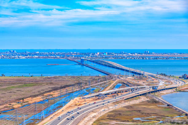The Galveston Causeway, named  the George and Cynthia Mitchell Memorial Causeway, linking Galveston Island with the Houston metropolitan area shot via helicopter from an altitude of about 600 feet on a sunny afternoon