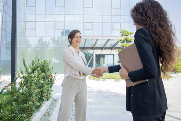 istock Two businesswomen are talking outside 2041530522