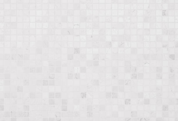 istock White tile wall chequered background bathroom texture. Ceramic brick wall and floor tiles mosaic background in bathroom and kitchen clean. Design pattern geometric with grid wallpaper floor elements. 2041532165