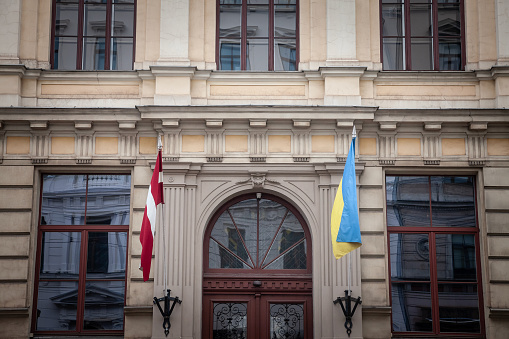 Picture of the dutch and Latvian flags waiving together in Riga, celebrating the solidarity between Latvia and Ukraine in the war against russia.