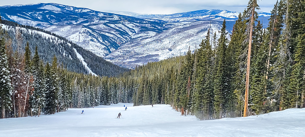 Snowmass, Colorado, USA- February 10, 2023: Elk Camp Lift and skiers. Snowmass ski resort, Aspen, Colorado.