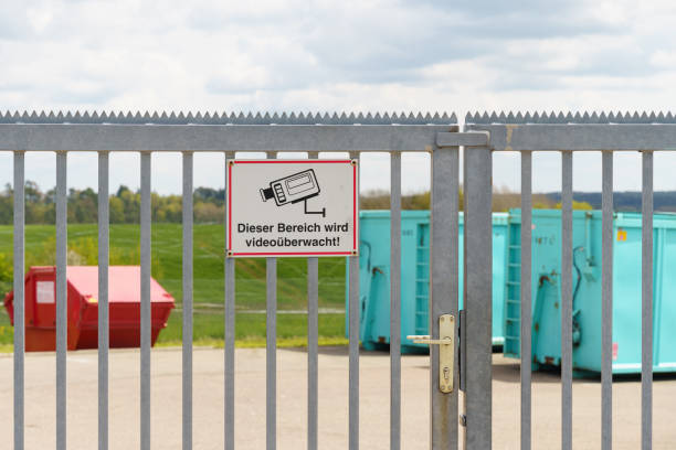 istock Metal fence with a sign - video surveillance is underway 2041634072