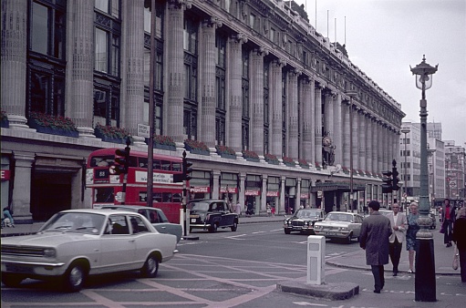 London, England, UK, 1972. Street scene on Oxford Street in the City of London. In the background is the Selfridge department store. Also: pedestrians and vehicles.