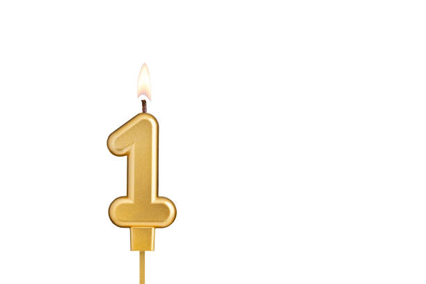 istock Golden number 1 birthday candle on white background 2041660250
