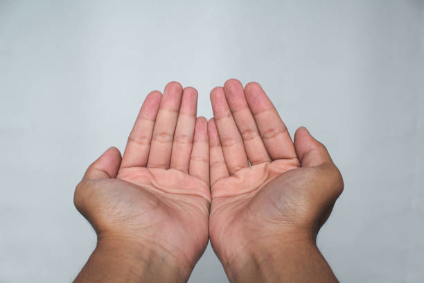 istock Muslim men praying with lifted hands 2041694555