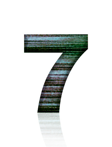 Close-up of three-dimensional Television Static number 7 on white background.