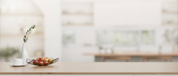 istock A wooden tabletop with a copy space with a blurred background of a modern Scandinavian kitchen. 2041756400