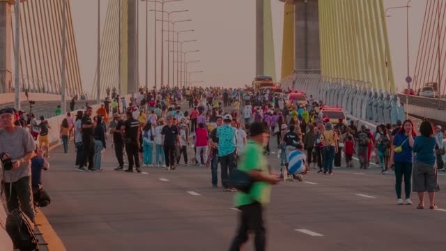 timelapse, people walking on the Rama IX parallel bridge