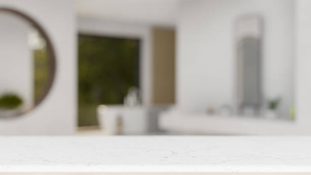 istock Empty mockup space on a luxury white tabletop with a blurred background of a modern white bathroom. 2041764133