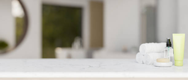 istock Toiletries and a copy space for display product on a white marble tabletop in a modern bathroom. 2041764643
