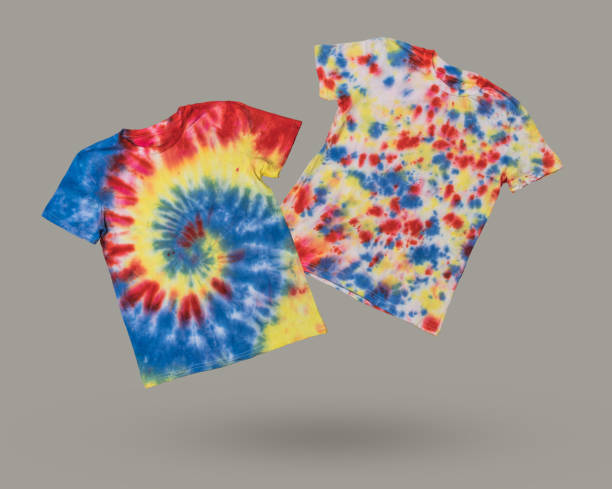 istock Two bright tie dye T-shirts on a gray background. 2041767707
