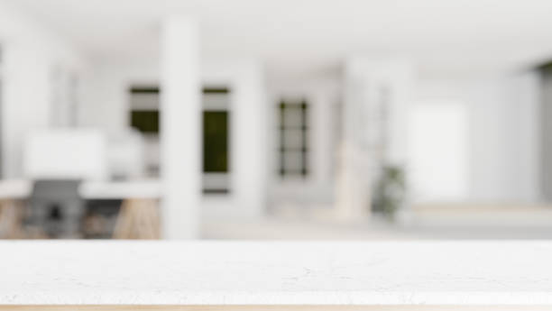 istock A white tabletop with empty space with a blurred background of a modern office room. 2041777624