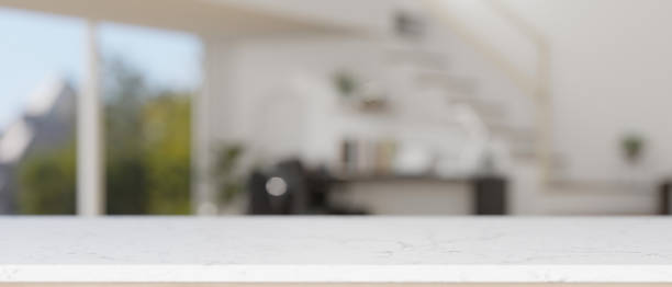 istock Empty mockup space on a white tabletop with a blurred background of a modern home office. 2041780226