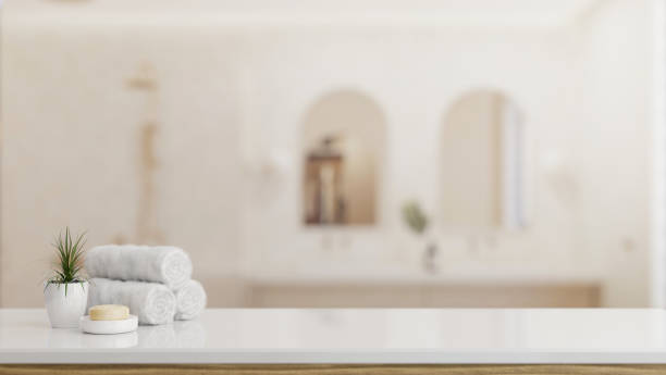 istock Toiletries and empty space on a white tabletop with a blurred background of a luxury bathroom. 2041788009