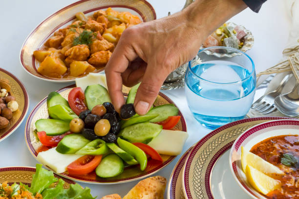 istock Hand take black olive on Traditional Turkish Ramadan-Iftar Table 2041825568