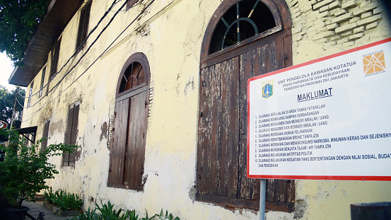 Jakarta, Indonesia - February 9, 2024: Warning sign not to damage old buildings in Kota Tua.