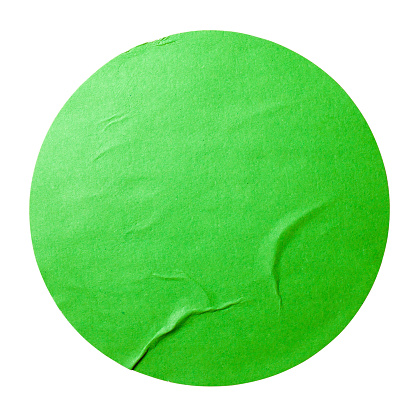 Round green paper sticker isolated on white background with clipping path