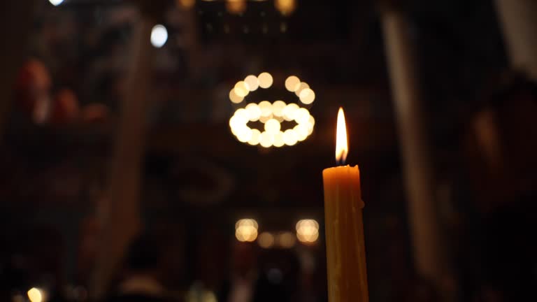 Lighting candle in Orthodox Church