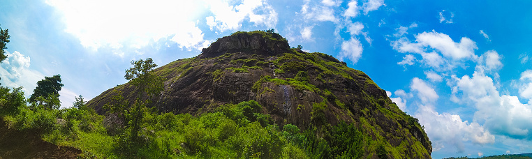 Panorama of Mount Lojeh with massive andesite rocks in it, located on the border of Trenggalek and Ponorogo