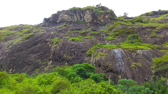 Panorama of Mount Lojeh with massive andesite rocks in it, located on the border of Trenggalek and Ponorogo