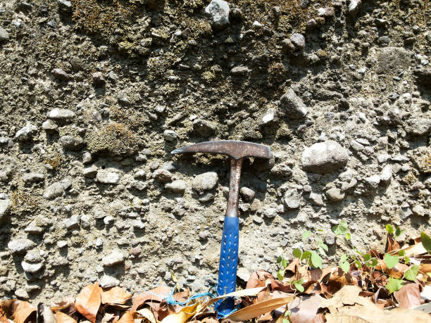 istock The texture of the breccia which is a mapping sample with a geological hammer as a comparison 2041954145