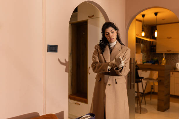 istock Woman putting on gloves while preparing to go out 2042004046