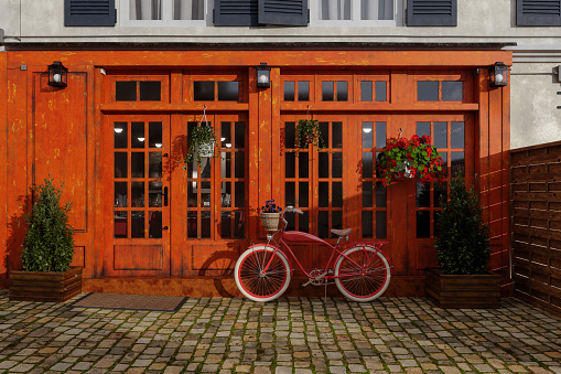 Vintage photo. Old bike installed in front of a house with a farmer's character. Stone building and wooden door. Vintage photo. Old bike installed in front of a farm house. Stone building and wooden door.