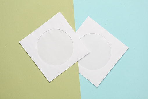 Mockup of paper bag for CD disc on pastel background