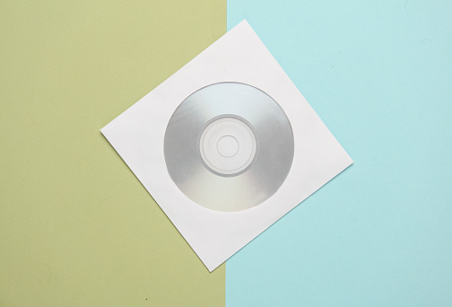 Mockup of CD disc in Paper pack on pastel background