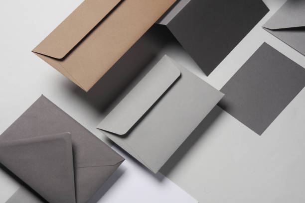 istock Floating envelopes and cards on gray background with shadow. Minimalism, modern business still life, creative layout 2042048426