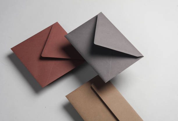 istock Floating envelopes on gray background with shadow. Minimalism, modern business still life, creative layout 2042049476
