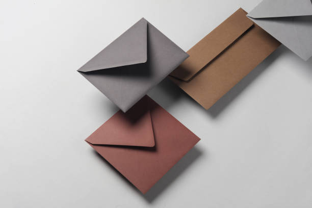istock Floating envelopes on gray background with shadow. Minimalism, modern business still life, creative layout 2042049488