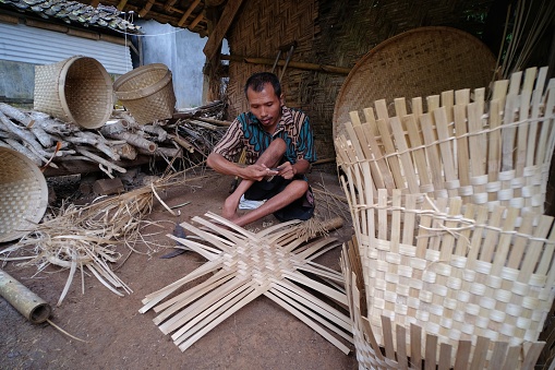 Yogyakarta, Indonesia, March 4, 2022. Bamboo craftsmen with disabilities who strive to be independent by working to make handicraft products.