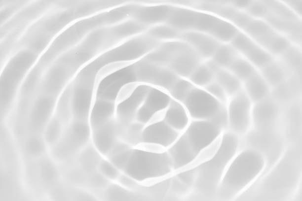 istock White water surface texture with ripples, splashes, and bubbles. Abstract summer banner background Water waves in sunlight with copy space cosmetic moisturizer micellar toner emulsion. White water. 2042066094