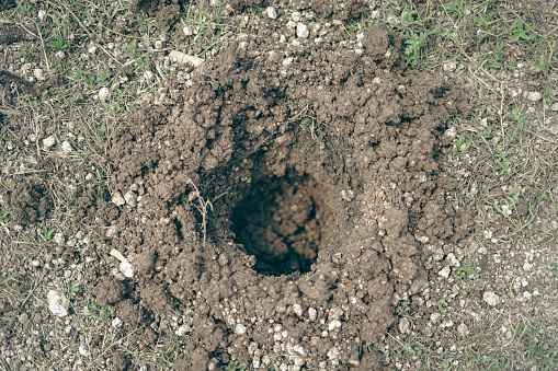 A hole in the ground that is dug into a hole. Top view