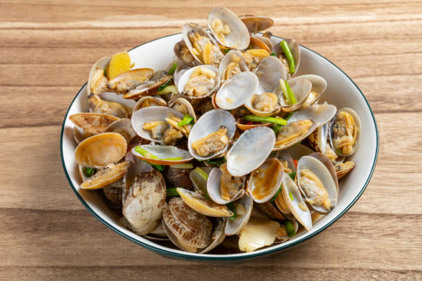 istock angle view fresh homemade stir-fried clams 2042084018