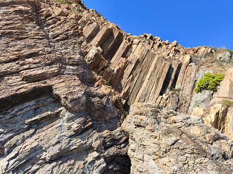Hexagonal rhyolitic rock columns at Kim Chu Wan beach, Hong Kong Unesco Global Geopark, Sai Kung peninsula.