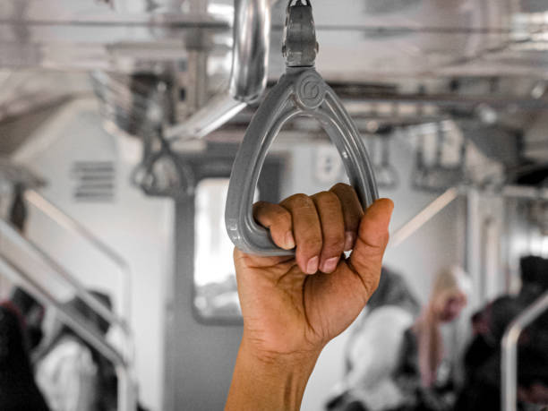 istock holding hands of people on the train 2042111709