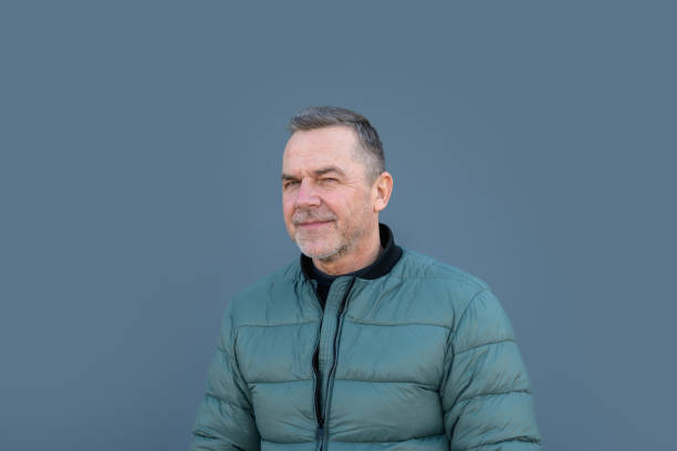 istock Portrait of a middle aged man looking with a funny look winking 2042131876