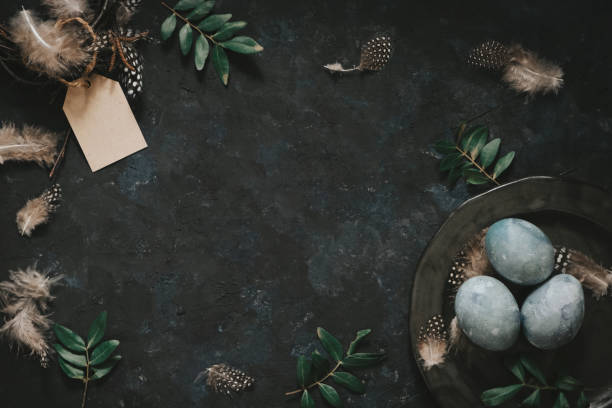 Natural dyed blue Easter eggs on dark gray background. Top view point. Easter celebration concept.
