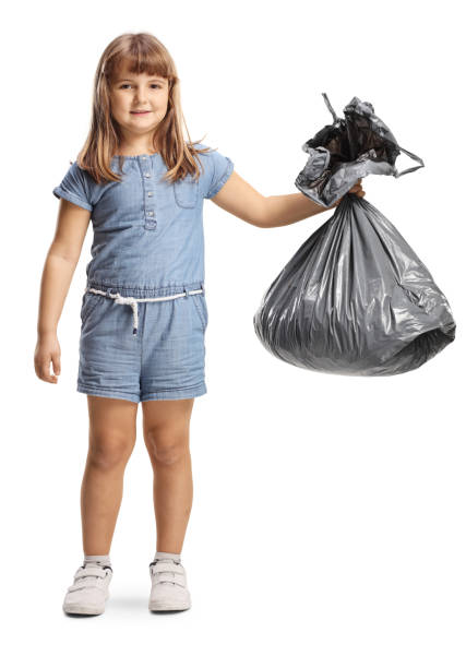 istock Little girl holding a plastic bin bag 2042190028