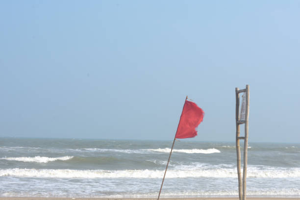 istock Red flag on an Indian beach, it denotes to dangerous area. 2042192672
